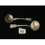 A PAIR OF VICTORIAN STERLING SILVER FIDDLE PATTERN SAUCE LADLES BY GEORGE ADAMS; LONDON 1858;