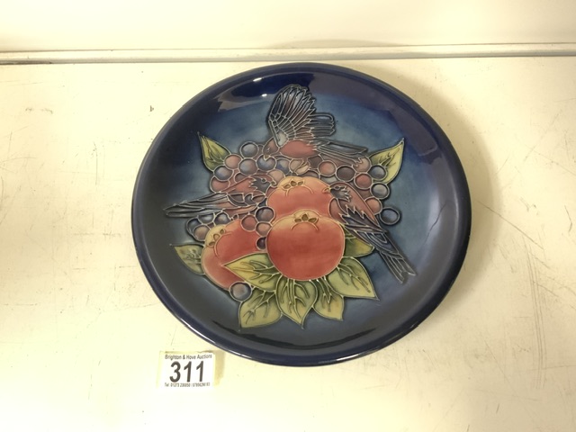 MOORCROFT; A FINCHES AND FRUIT PATTERN PLATE / CHARGER DESIGNED BY SALLY TUFFIN, ON DARK BLUE
