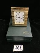 A JACCARD BY HISLER GILT METAL ALARM CLOCK, REEDED DECORATION, ROMAN NUMERALS, IN PRESENTATION BOX