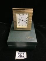 A JACCARD BY HISLER GILT METAL ALARM CLOCK, REEDED DECORATION, ROMAN NUMERALS, IN PRESENTATION BOX