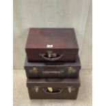 THREE VINTAGE LEATHER SUITCASES ONE WITH LUGGAGE LABELS AND ONE WITH INNER SHELF LARGEST 45 X 39CM