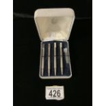 A BOXED SET OF FOUR STERLING SILVER AND ENAMEL BRIDGE PROPELLING PENCILS; BIRMINGHAM 1990; ENGINE