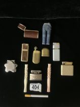 A QUANTITY OF POCKET LIGHTERS, SOME NOVELTY EXAMPLES INCLUDING; ONE MODELLED AS A CIGARETTE, ONE