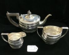 HALLMARKED SILVER OVAL THREE PIECE TEA SERVICE WITH REEDED BORDERS AND FRUIT WOOD HANDLE DATED