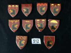 TEN METAL AND ENAMEL SOUTH AFRICAN ARMY PARACHUTE BRIGADE FLASHES, VARIOUS DESIGNS; HEIGHT 6CM