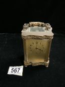 A 19TH CENTURY FRENCH BRASS CASED CARRIAGE CLOCK WITH RELIEF MOULDED SERPENTINE BORDERS, CAST SCROLL
