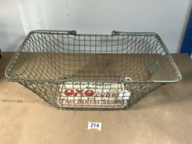 VINTAGE WIRE BASKET WITH A METAL OXO CUBES SIGN AT BASE