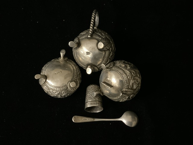 A MIDDLE EASTERN WHITE METAL THREE PIECE CONDIMENT SET; GLOBULAR FORM; EMBOSSED WITH FLORAL SCROLLS; - Image 2 of 2