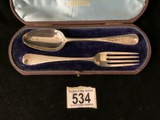 A BOXED GEORGE III STERLING SILVER MATCHED CHRISTENING SPOON AND FORK; THE SPOON BY CHRISTIAN KER