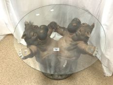 OCCASSIONAL ROUND TABLE HELD UP BY TWO HIPPO'S ON THE BASE 69CM DIAMETER
