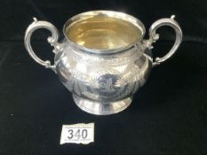 A VICTORIAN STERLING SILVER TWO HANDLED SUGAR BOWL BY MARTIN & HALL; LONDON 1882, SCROLL HANDLES,