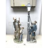 TWO LARGE PIECES OF LLADRO (05205, 085). LAMPLIGHTER; 48CM AND FATHERS PRIDE; 33CM
