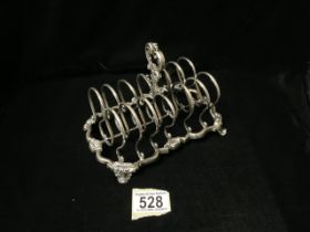 A VICTORIAN STERLING SILVER 7 BAR TOASTRACK BY REILY & STORER; LONDON 1847; DOUBLE LOOP BARS; SCROLL