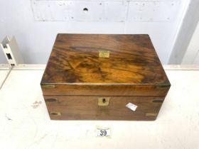 AN ANTIQUE MAHOGANY AND BRASS MOUNTED WRITING SLOPE; VARIOUS COMPARTMENTS; LENGTH 30CM