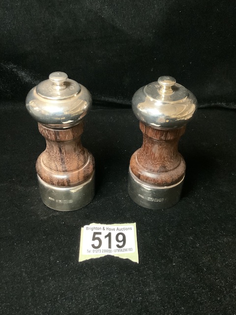 A PAIR OF SILVER AND WOOD SALT & PEPPER MILLS / GRINDERS; LONDON 1990/92; WAISTED FORM; HEIGHT 10.