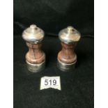 A PAIR OF SILVER AND WOOD SALT & PEPPER MILLS / GRINDERS; LONDON 1990/92; WAISTED FORM; HEIGHT 10.