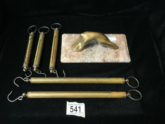 FIVE VINTAGE BRASS SPRUNG SCALES; IN TROY OUNCES AND A BRASS AND MARBLE PAPERWEIGHT; MODELLED AS A