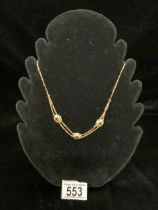 A VINTAGE CITRINE 18 CARAT GOLD NECKLACE; THE CLASP STAMPED '750'; THE THREE OVAL CITRINES IN