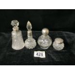 FOUR ANTIQUE GLASS AND SILVER SCENT BOTTLES / VANITY JAR, COMPRISING; A CUT GLASS EXAMPLE; LONDON