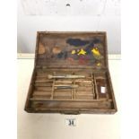 A VINTAGE WOODEN ARTISTS TRAVELLING PAINT BOX WITH REMOVABLE PALETTE