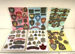 QUANTITY OF MILITARY CANADIAN CLOTH AND METAL BADGES