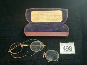 A VINTAGE BOXED PAIR OF GOLD GLASSES; STAMPED 10 CT AND ANOTHER GOLD MOUNTED LENS