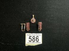 A VINTAGE GILT AND GARNET PENDANT AND EARRING SET, STAMPED '900' 'G', PENDANT IN THE FORM OF A