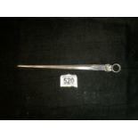A STERLING SILVER LETTER OPENER; LONDON 1958; IN THE FORM OF A MEAT SKEWER; WITH SHELL AND RING