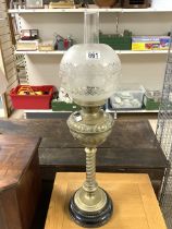 TALL VICTORIAN EMBOSSED BRASS OIL LAMP WITH SHADE AND SPIRAL TURNED COLUMN ON A CIRCULAR PLATFORM