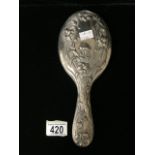 AN EDWARDIAN STERLING SILVER ART NOUVEAU HAND MIRROR; BIRMINGHAM 1904; EMBOSSED WITH STYLISED