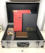 A METAL CASE CONTAINING VARIOUS COINS; IN FOLDERS AND LOOSE