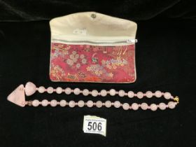 A VINTAGE CHINESE PINK QUARTZ BEAD NECKLACE, WITH CENTRAL TRIANGULAR PENDANT