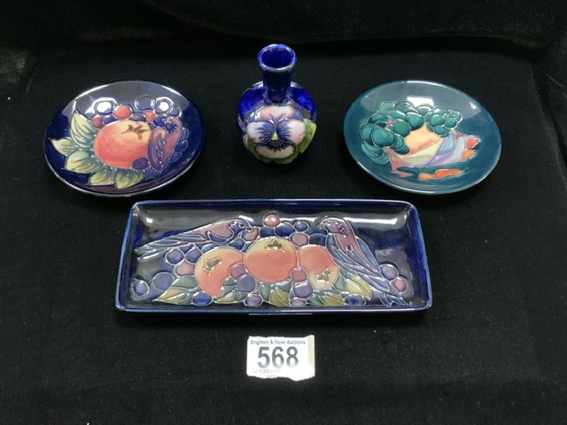 MOORCROFT: FOUR ITEMS, COMPRISING A DISH AND PIN TRAY IN POMEGRANATE, GRAPE AND BIRD PATTERN, A