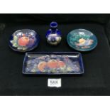 MOORCROFT: FOUR ITEMS, COMPRISING A DISH AND PIN TRAY IN POMEGRANATE, GRAPE AND BIRD PATTERN, A