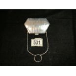 A STERLING SILVER COIN PURSE ON CHAIN; HALLMARKS RUBBED; DATE LETTER r; SHAPED FORM WITH ENGRAVED