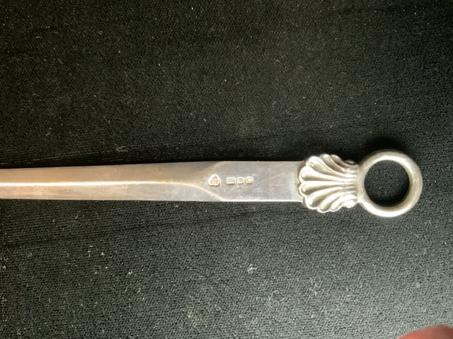 A STERLING SILVER LETTER OPENER; LONDON 1958; IN THE FORM OF A MEAT SKEWER; WITH SHELL AND RING - Image 2 of 2