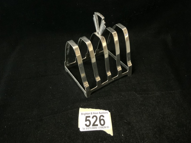 AN ART DECO STERLING SILVER 5 BAR TOASTRACK BY HENRY PIDDICK & SONS; BIRMINGHAM 1939; WITH