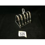 AN ART DECO STERLING SILVER 5 BAR TOASTRACK BY HENRY PIDDICK & SONS; BIRMINGHAM 1939; WITH