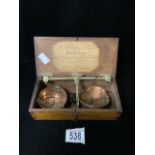 A VICTORIAN BOXED SET OF COPPER AND BRASS TRAVELLING TEA SCALES BY WILLIAM WILLIAMS & SONS;