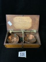 A VICTORIAN BOXED SET OF COPPER AND BRASS TRAVELLING TEA SCALES BY WILLIAM WILLIAMS & SONS;