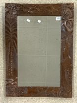 CARVED WOODEN SURROUND 'AFRICAN THEME' WALL MIRROR; 60.5 X 86CM