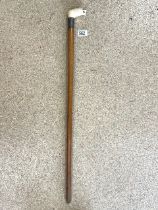 VINTAGE WALKING STICK WITH A BONE CARVED LION HANDLE AND WHITE METAL COLLAR