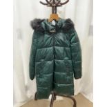 A DKNY MID-LENGTH METALLIC GREEN COAT WITH A FUR-LINED HOOD; US SIZE M