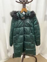 A DKNY MID-LENGTH METALLIC GREEN COAT WITH A FUR-LINED HOOD; US SIZE M