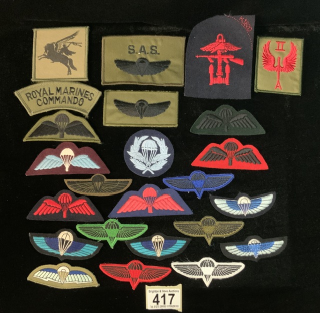 A QUANTITY OF MILITARY CLOTH BADGES INCLUDING; ROYAL MARINES COMMANDO, COMBINED OPERATIONS, RAF