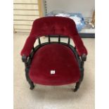 VICTORIAN EBONISED ARMCHAIR GALLEY RAIL BACKED WITH RED VELVET COVERING AND ON ORIGINAL CASTORS