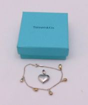 Tiffany white metal Elsa Peretti five teardrop bracelet in a Tiffany box and a hallmarked silver