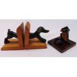A pair of bronze and wood dog bookends and an unusual 1930s vesta match striker