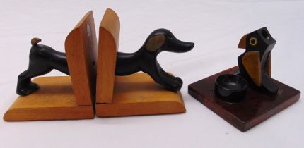 A pair of bronze and wood dog bookends and an unusual 1930s vesta match striker