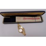 Rotary 9ct yellow gold ladies wristwatch on a 9ct gold articulated bracelet to include original